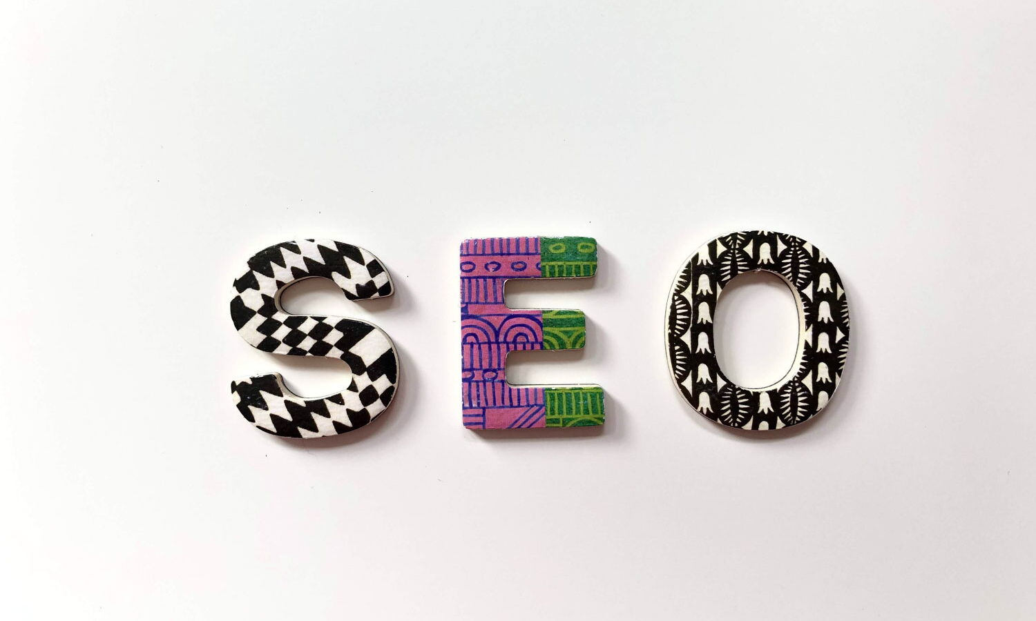 Graphic of the word SEO with each letter styled differently